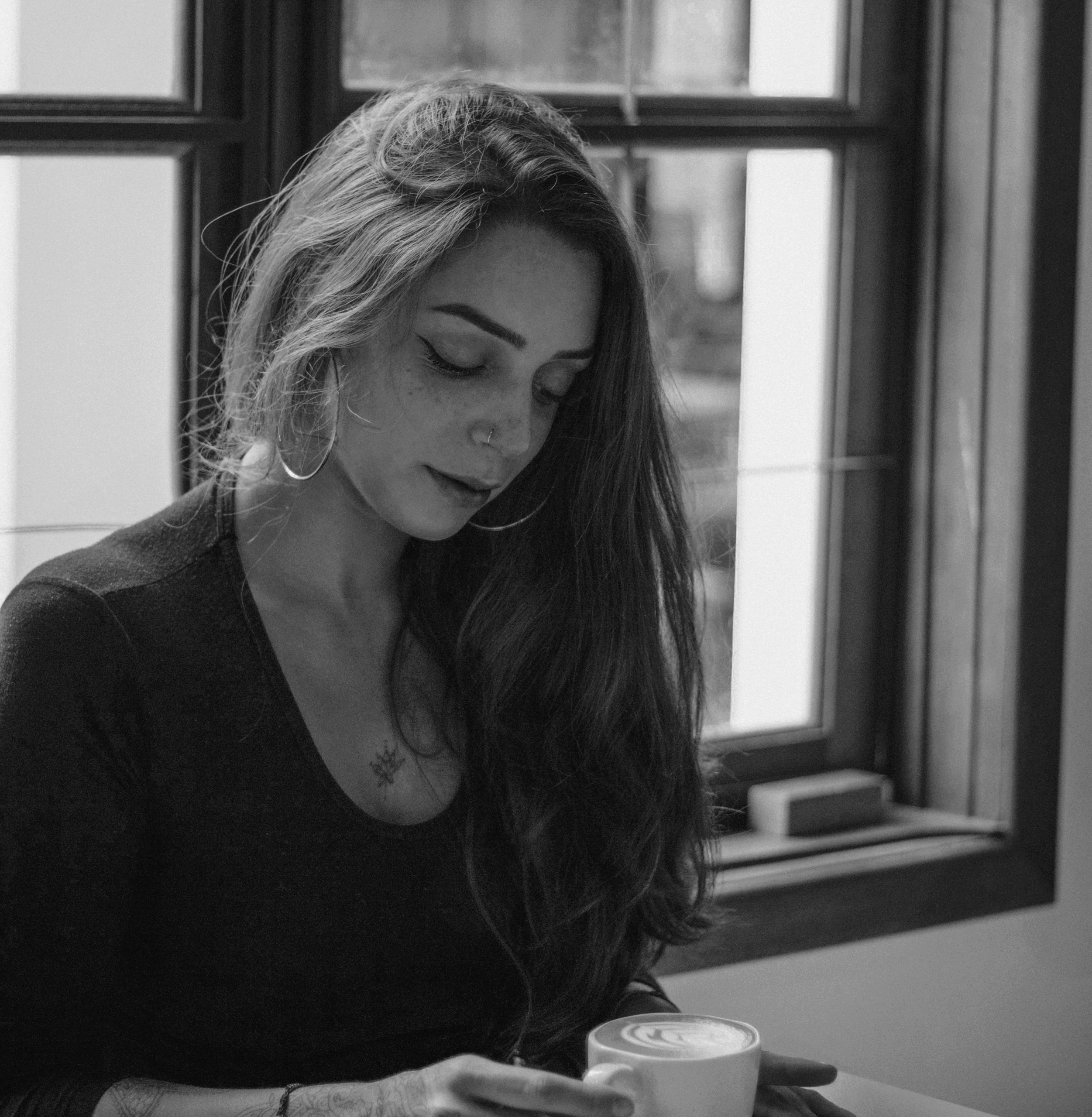 a woman having a coffee