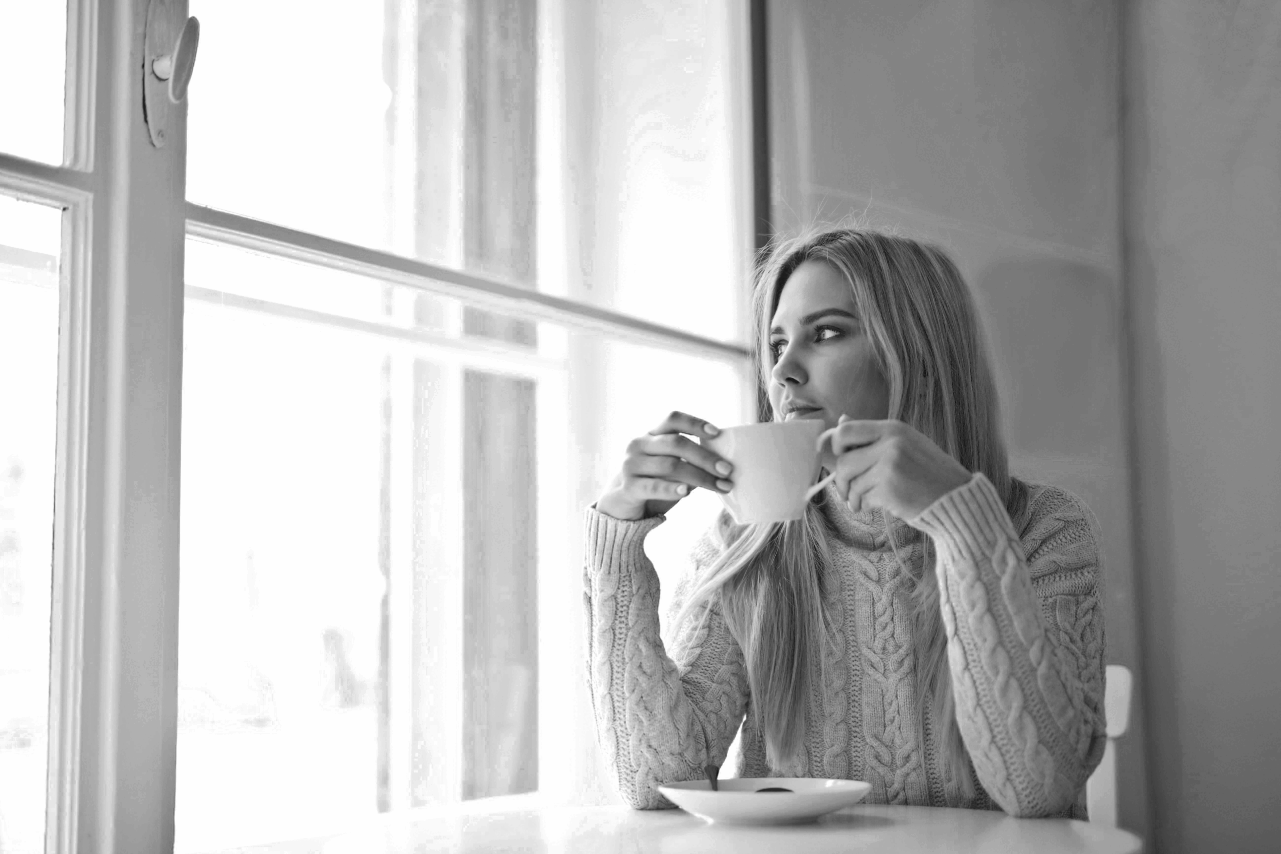 a woman having a coffee